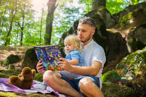 dad reading with his daughter