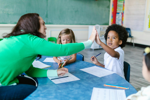 teacher interacting with kids