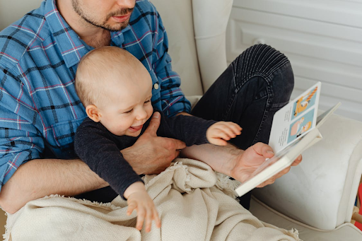 father reading with toddler