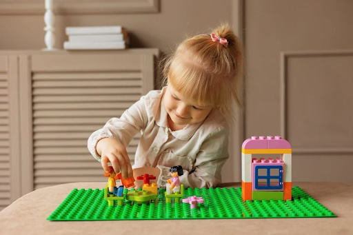 a girl playing with toys