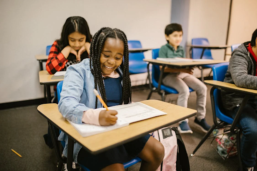 a girl writing happily