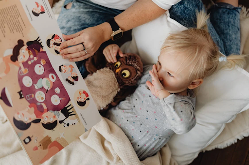 a small girl reading