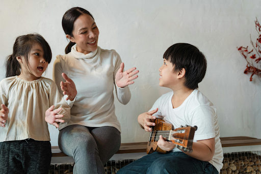 women singing with kids