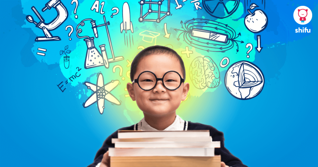 kid with black glasses holding books and smiling