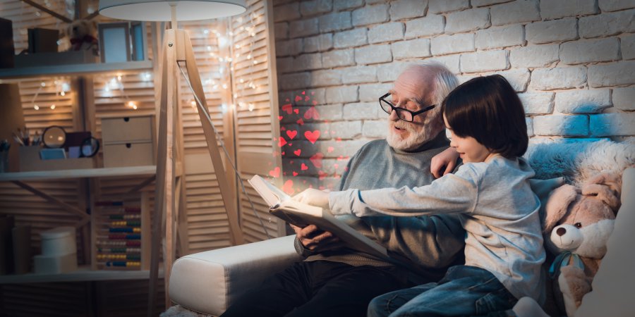 Grandfather Reading Fairy Tale to Little Grandson.