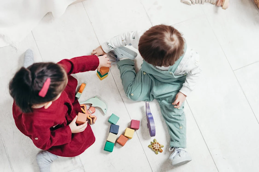 siblings playing with shapes