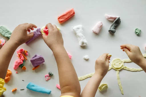 children playing with clay